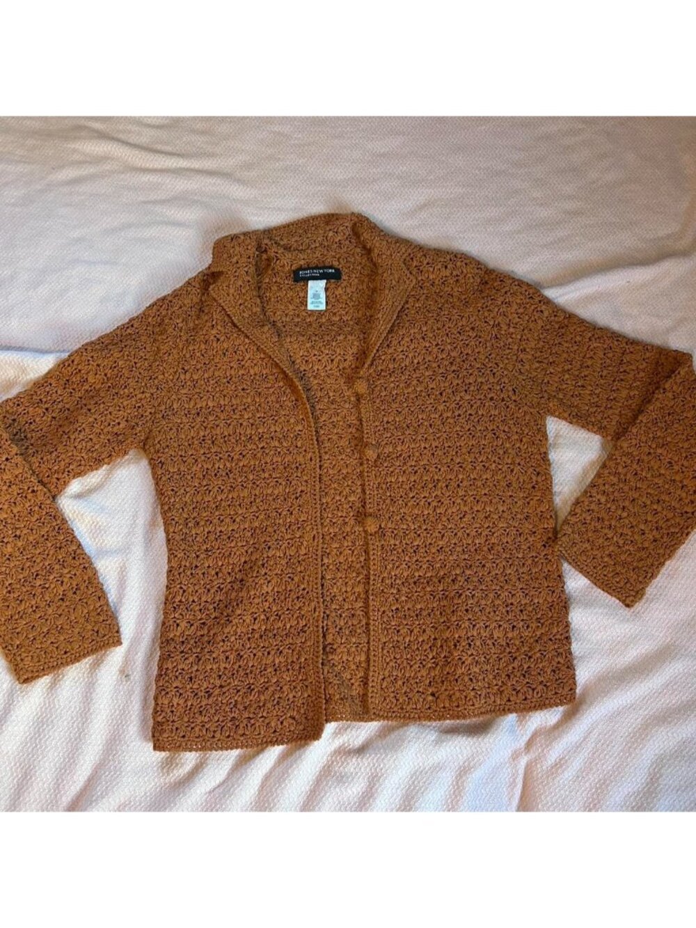 Orange crochet cardigan with button up front. Vibrant  and comfortable.